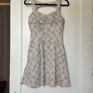 Black poppy fit and flare floral dress with pockets and back cut out